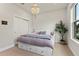 Cozy bedroom featuring a chandelier and ample natural light at 327 Island Sound Ct, Longwood, FL 32779
