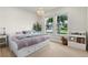 Bright bedroom featuring large windows and neutral decor at 327 Island Sound Ct, Longwood, FL 32779