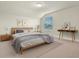 Bright bedroom with a modern bed, stylish décor, and plenty of natural light from the window at 327 Island Sound Ct, Longwood, FL 32779