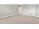 Bedroom featuring neutral carpet, white trim, and paneled doors at 327 Island Sound Ct, Longwood, FL 32779