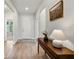 Inviting entryway with wood-look tile flooring and a stylish console table at 327 Island Sound Ct, Longwood, FL 32779