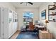 Bright home office with built-in shelving and a view of the neighborhood at 327 Island Sound Ct, Longwood, FL 32779
