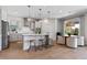 Modern kitchen with island, pendant lights, and stainless appliances at 327 Island Sound Ct, Longwood, FL 32779