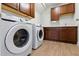 Laundry room features modern washer and dryer, along with cabinetry providing plenty of storage space at 327 Island Sound Ct, Longwood, FL 32779