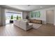 Open living room with large sliding doors to the outdoor patio at 327 Island Sound Ct, Longwood, FL 32779
