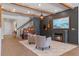 Stylish living room featuring wood beams, a fireplace, and elegant furnishings at 327 Island Sound Ct, Longwood, FL 32779