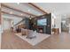Inviting living room with wood beam ceiling, fireplace, and decor at 327 Island Sound Ct, Longwood, FL 32779