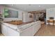 Bright living room with beamed ceilings and stylish furniture at 327 Island Sound Ct, Longwood, FL 32779