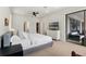 Spacious main bedroom with neutral carpet, a ceiling fan, and a sliding glass door at 327 Island Sound Ct, Longwood, FL 32779