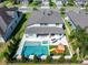 Aerial view of in-ground pool, hot tub, and backyard play area in fenced backyard at 327 Island Sound Ct, Longwood, FL 32779