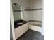 Bathroom featuring vanity with a granite countertop, a tub, and white tile at 3344 Corona Village Way # 205, Orlando, FL 32835