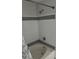 Bathroom featuring tub/shower combo with white tile and modern fixtures at 3344 Corona Village Way # 205, Orlando, FL 32835