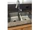 Kitchen sink with granite countertops and wood cabinets at 3344 Corona Village Way # 205, Orlando, FL 32835