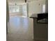 Bright living room featuring tile floors, ceiling fans, and large windows at 3344 Corona Village Way # 205, Orlando, FL 32835