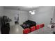 Living room features tiled floors, gray couch and adjacent breakfast bar with red barstools at 3379 S Kirkman Rd # 1015, Orlando, FL 32811