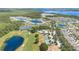 Aerial view of a Primary-planned community with beautiful homes, lakes, and golf courses, showcasing a vibrant and desirable lifestyle at 3443 Sagebrush St, Harmony, FL 34773
