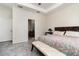 Inviting bedroom showcasing tile floors, a cozy bed, and a door to the bathroom, promoting convenience and comfort at 3443 Sagebrush St, Harmony, FL 34773