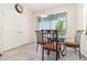 Charming dining area featuring a glass-topped table set and sliding glass doors to the exterior at 3443 Sagebrush St, Harmony, FL 34773
