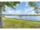 Scenic view of a tranquil lake with lush green surroundings, offering a serene and picturesque setting at 3443 Sagebrush St, Harmony, FL 34773