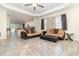 Spacious living room featuring tile flooring and contemporary furnishings with backyard access at 3443 Sagebrush St, Harmony, FL 34773