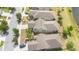 A high aerial view of the rear of several residences showcasing the well manicured properties and well designed streetscape at 3443 Sagebrush St, Harmony, FL 34773