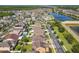 Extensive aerial view displays the property's location within a community near a lake and major roadways at 3450 Puxton Dr, Orlando, FL 32824