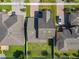 Aerial perspective of the property, highlighting the roof, driveway, and the home's position in the neighborhood at 3450 Puxton Dr, Orlando, FL 32824