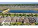 Wide aerial shot of the home's location, showing the nearby lake, community features, and surrounding roads at 3450 Puxton Dr, Orlando, FL 32824
