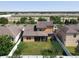 Aerial view of the home showcasing the backyard, neighboring houses, and surrounding landscape at 3450 Puxton Dr, Orlando, FL 32824