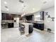 Kitchen with stainless steel appliances, granite countertops, dark cabinets, with an eat-in bar at 3450 Puxton Dr, Orlando, FL 32824
