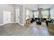 Living room with neutral walls, decorative wall hangings, wood-style flooring, and stylish couches at 3450 Puxton Dr, Orlando, FL 32824