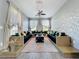 Bright living room showcasing custom seating, decorative accents, and large windows with elegant sheer curtains at 3450 Puxton Dr, Orlando, FL 32824