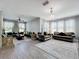 Spacious living room with couches, ornate decorative walls, wood flooring, and lots of natural light at 3450 Puxton Dr, Orlando, FL 32824