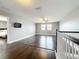 Upstairs loft with hardwood floors, a ceiling fan, and natural light at 3450 Puxton Dr, Orlando, FL 32824