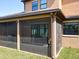 The screened patio has a view of the home's yard at 3450 Puxton Dr, Orlando, FL 32824