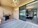 The screened patio provides indoor outdoor flow into the dining area and backyard at 3450 Puxton Dr, Orlando, FL 32824