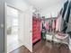 Bright walk-in closet featuring an armoire, clothing racks, shelves, and a vanity space at 3450 Puxton Dr, Orlando, FL 32824