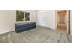 Neutral bedroom featuring a window, closet, and an ottoman at 3831 River Hollow Ct, Oviedo, FL 32765