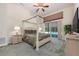 Spacious bedroom featuring a four-poster bed and sliding doors to the pool area at 3831 River Hollow Ct, Oviedo, FL 32765