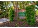 Welcoming brick signage for River Walk, surrounded by lush greenery and mature trees at 3831 River Hollow Ct, Oviedo, FL 32765