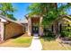 Charming front exterior of a brick home with a well-manicured lawn and inviting entrance at 3831 River Hollow Ct, Oviedo, FL 32765