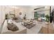 Open-concept living and dining area with neutral tones, stylish furniture, and sliding glass doors to the patio at 3831 River Hollow Ct, Oviedo, FL 32765