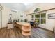 Home office space featuring a large desk, natural light, and wood-look floors at 3831 River Hollow Ct, Oviedo, FL 32765