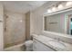 Updated bathroom features tiled shower, new vanity with granite countertop and modern fixtures at 3960 Southpointe Dr # 501, Orlando, FL 32822