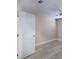 Bedroom with wood-look floors, neutral paint, white door and trim at 3960 Southpointe Dr # 501, Orlando, FL 32822