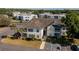 Exterior view of a two-story condo building with reserved parking and tropical landscaping at 3960 Southpointe Dr # 501, Orlando, FL 32822