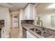 Well-lit kitchen with granite counters, stainless steel appliances, and tile backsplash at 3960 Southpointe Dr # 501, Orlando, FL 32822