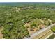 Aerial view features a large property with mature trees and street access at 4000 Rouse Rd, Orlando, FL 32817