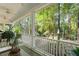 Inviting back porch with comfortable seating overlooking the lush backyard landscape at 4000 Rouse Rd, Orlando, FL 32817