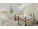 Bright bedroom with two twin beds, plush carpet and cheerful decor at 4000 Rouse Rd, Orlando, FL 32817